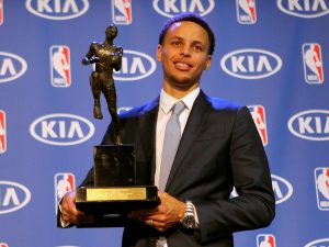 Golden State Warriors guard Stephen Curry accepts the NBA KIA Most Valuable Player for the 2014-2015 Season at the Warriors Training Facility in Oakland, Calif., on Monday, May 2, 2015.